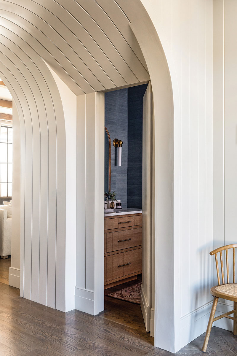 Hidden Powder Room within Arched Passageway