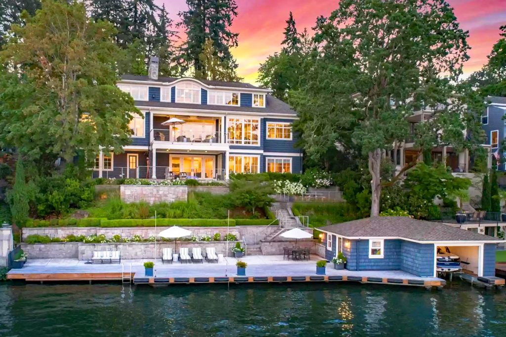 Beach Style Waterfront Home with Boathouse on Oswego Lake