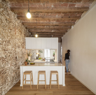 Newly Renovated Minimalist Apartment With Stone Wall And Wooden Beams ...