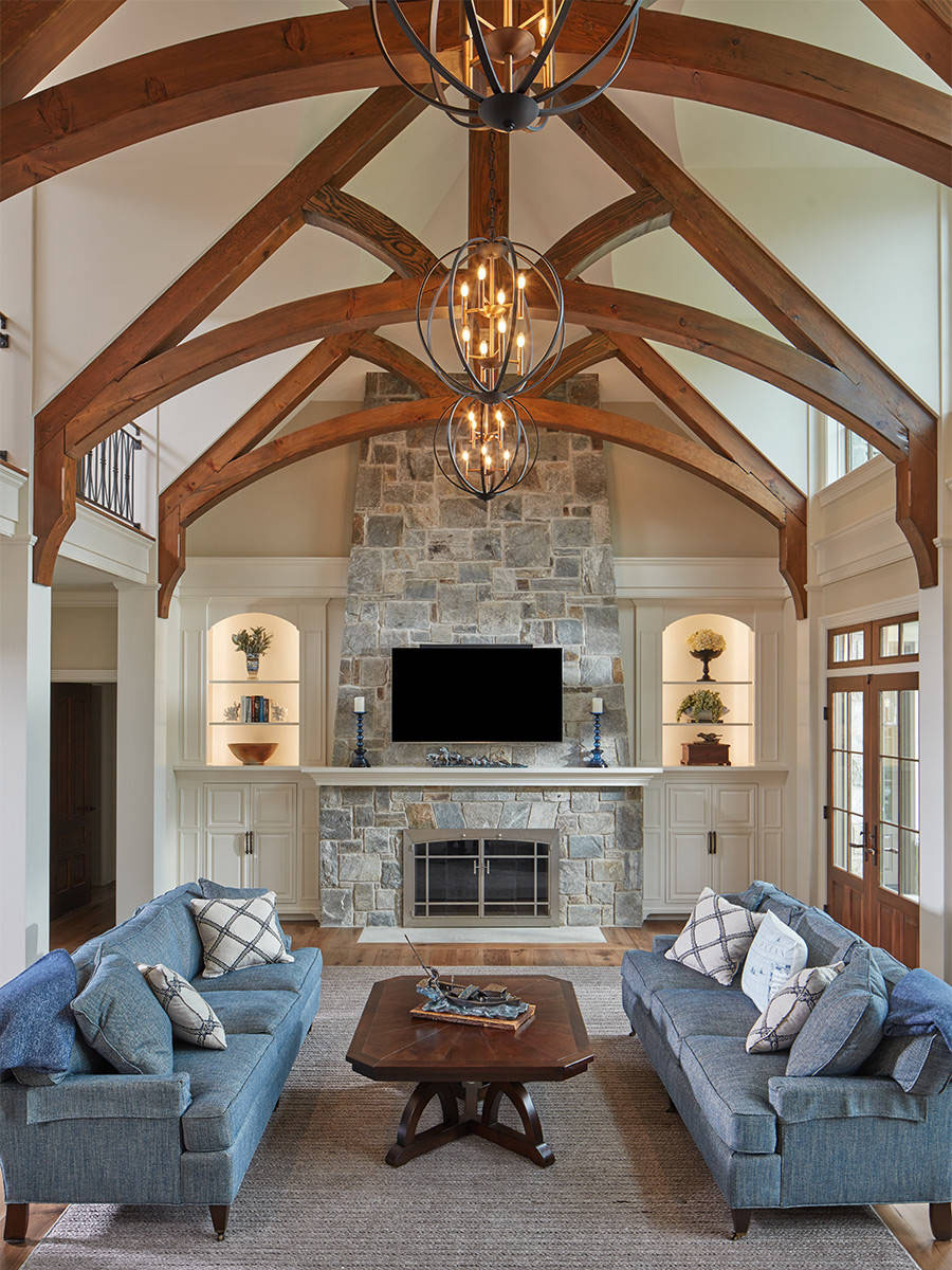 Grand Room with Exposed Timber Trusses and Stone Fireplace