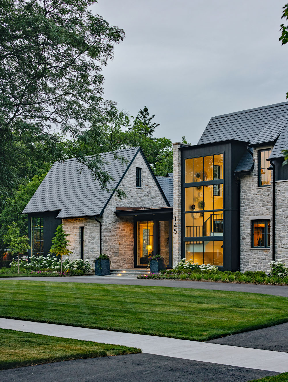 Stone a Glass Home with Transparent Design