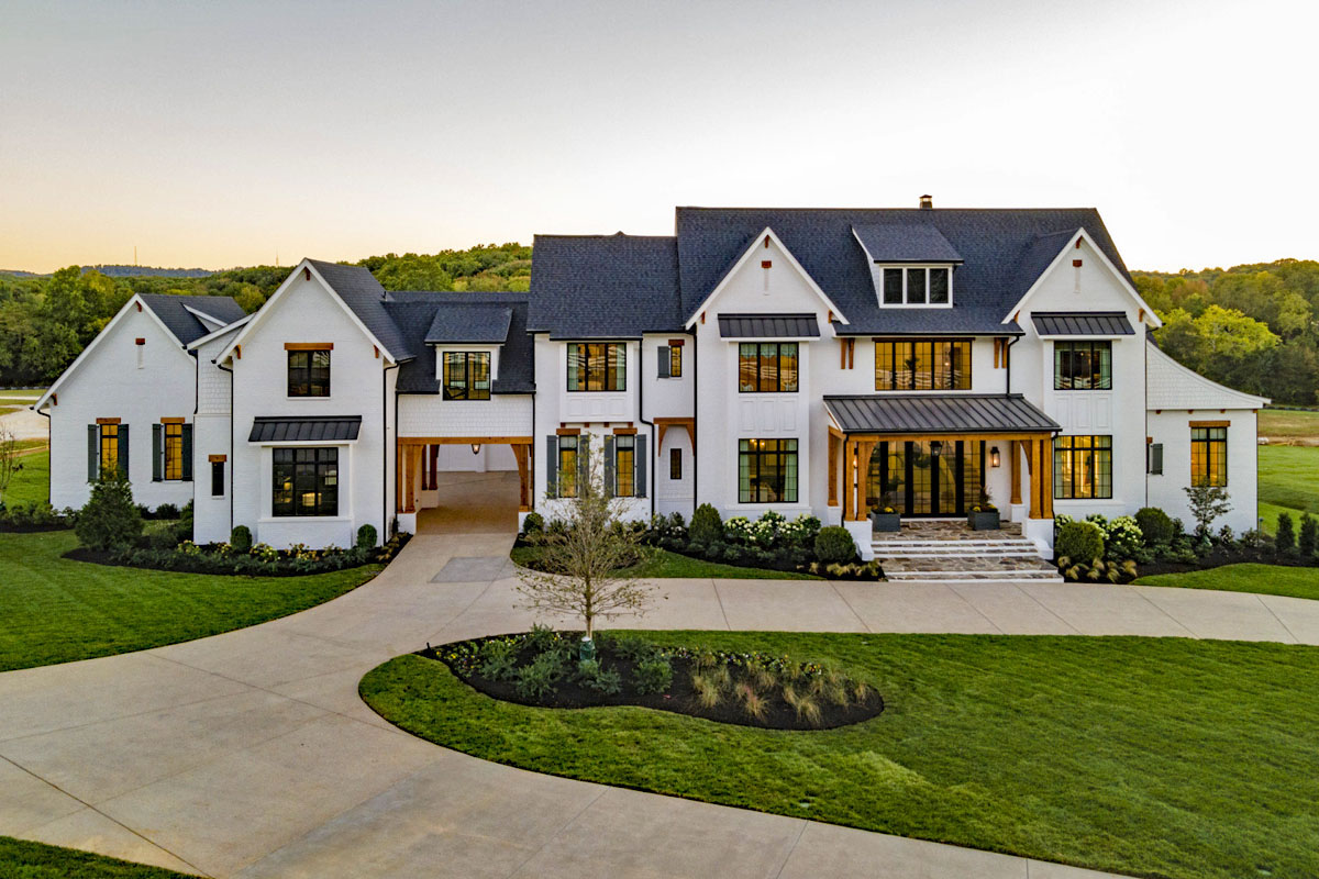 Cedar Headers and Columns Accent the Front Porch and Porte Cochere