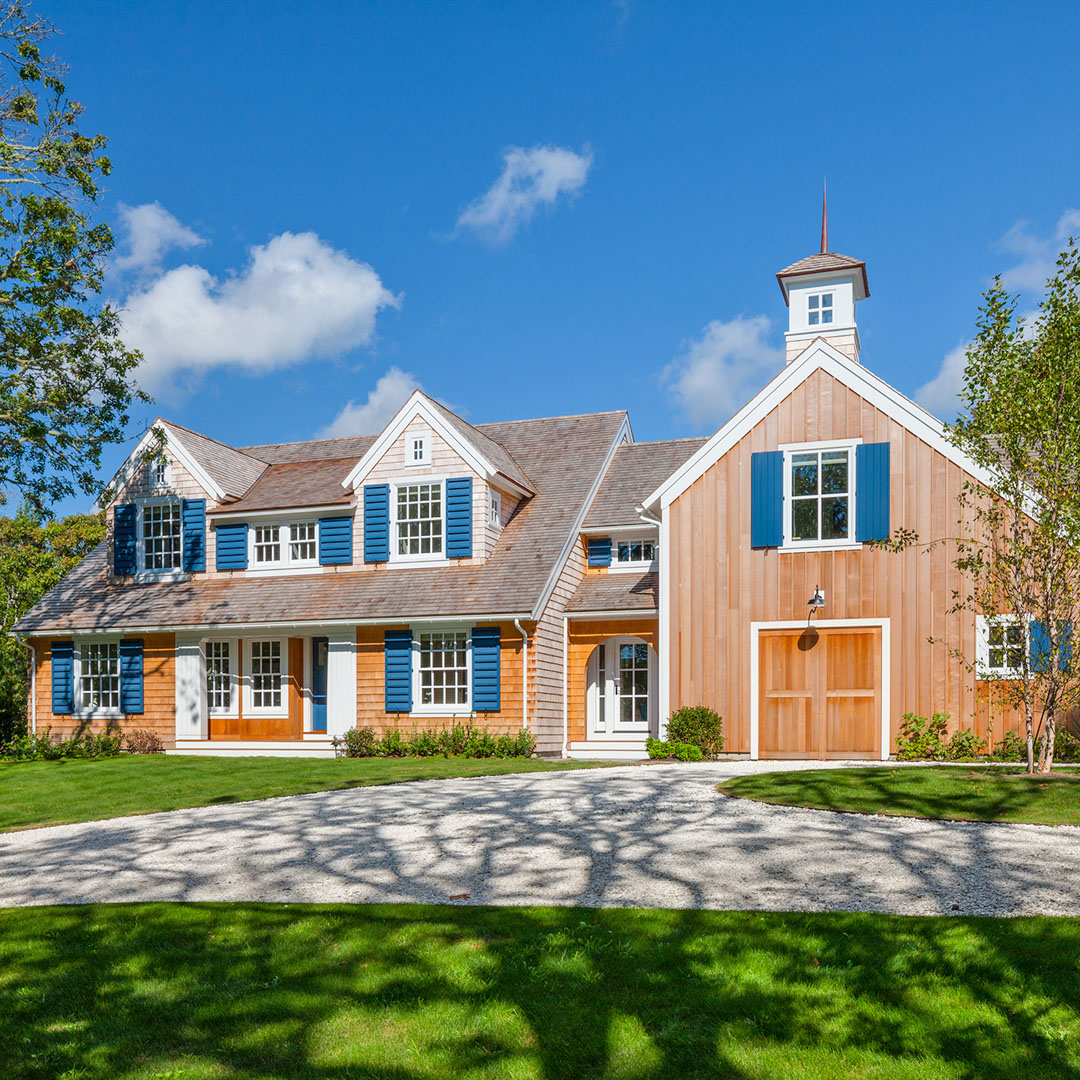 Cedar Shingle-Style Barn-Like Exterior with Blue Shutters