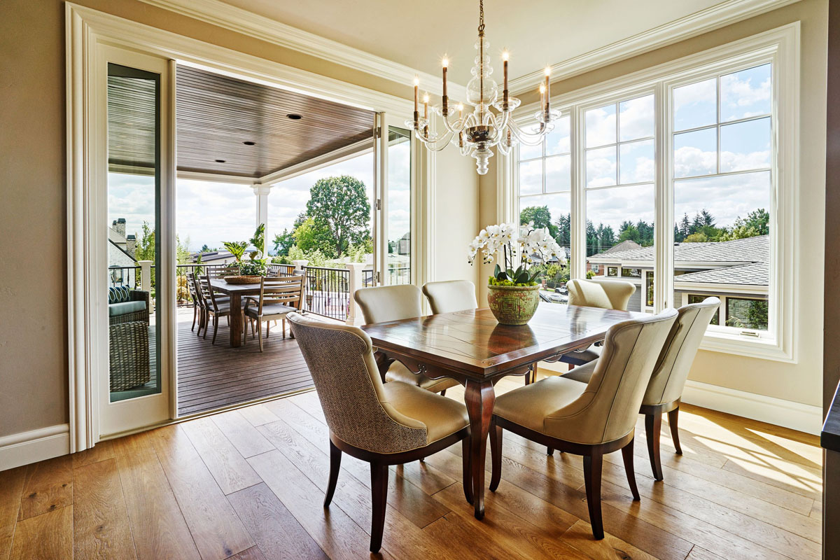 Dual dining spaces create a connection between indoor and outdoor