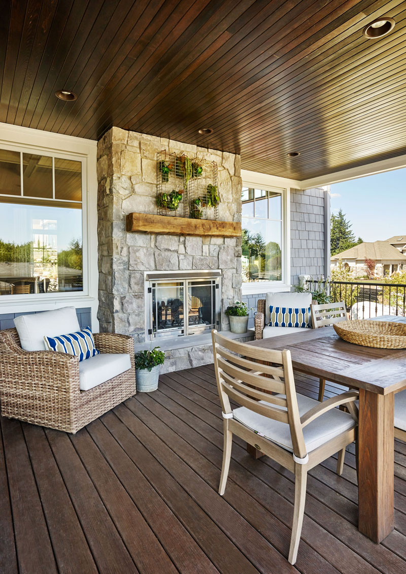 Covered Patio with Custom Stained Ceiling and Stone Fireplace